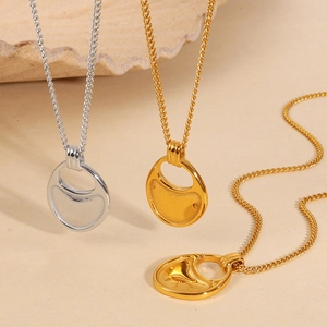 Three minimalist geometric hollow necklaces in gold and silver finish with textured pendants