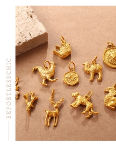 Macro detail of various golden 3D animal charms like lion and elephant with matte texture