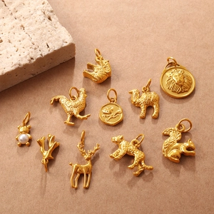 Matte gold animal pendants including lions and elephants with pearl bear for DIY jewelry
