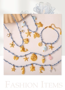Detail of blue braided necklaces with golden ocean pendants like dolphin and starfish