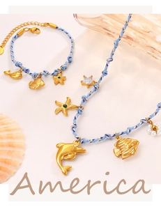 Detail of ocean-themed blue rope jewelry set with starfish, dolphin, and shell charms