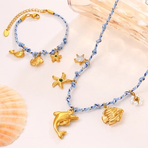 Blue ocean-themed jewelry set with golden starfish, dolphin charms, and stainless steel chain