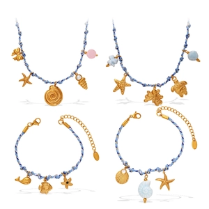 Ocean themed jewelry set with blue braided rope and gold marine life charms