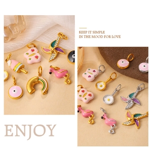 Detail of colorful enamel ice cream and evil eye charms for DIY jewelry making
