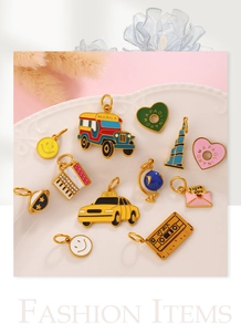 Assorted enamel taxi and jeepney charms displayed on a decorative ceramic plate