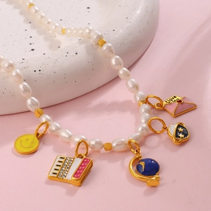 Freshwater pearl necklace with colorful enamel smiley face and globe pendants