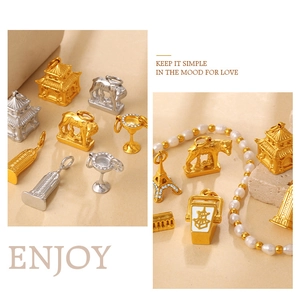 Detailed view of vintage gold and silver pendants with Eiffel Tower and pagoda designs