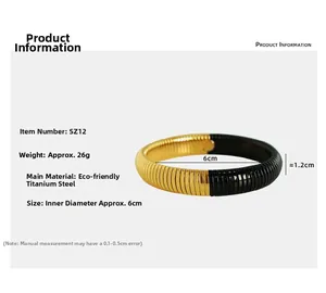 Detailed view of 12mm wide titanium steel snake-bone bangle with black and gold contrast