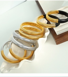 Close-up of 12mm stainless steel tubogas snake bracelets in gold, silver and two-tone finishes
