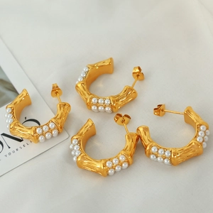 Vintage gold C-shaped hoop earrings with bamboo texture and double row pearl inlay