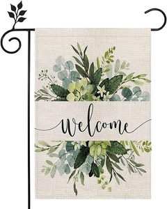 Detail of linen garden flag with floral welcome print and black metal hanging stand