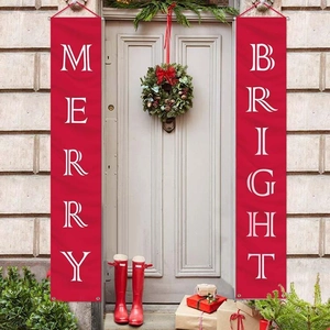 Detail of red Merry Bright Christmas porch banners hanging on front door decorations