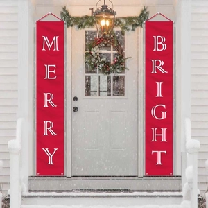 Detail of red Merry Bright Christmas porch banners hanging on a snowy door