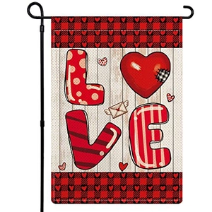 Garden flag with Love art lettering and red buffalo plaid pattern on light wood background