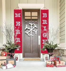 Detail of red Merry and Bright Christmas door banners with white artistic lettering