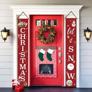 Close-up detail of Merry Christmas and Let It Snow festive red polyester porch banners