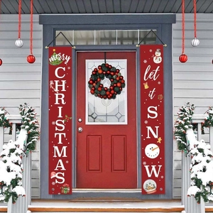 Detail view of Merry Christmas banners with snowman and tree designs on a snowy porch
