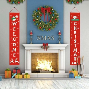 Close-up of Welcome Christmas porch banners featuring Santa and Snowman graphics