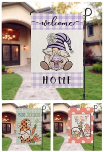 Close-up of three Easter garden flags featuring gnomes with welcome text on burlap texture