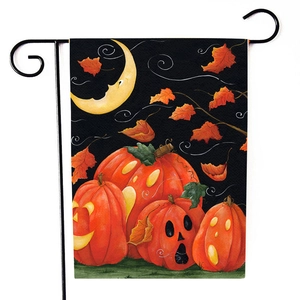 Detailed view of Halloween garden flag featuring pumpkins and moon on metal stand