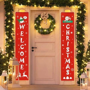 Outdoor Christmas porch decor with red Welcome Christmas banners and festive lighting