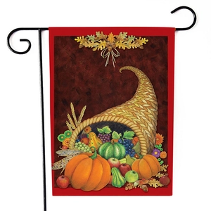 Detailed close-up of a seasonal garden flag featuring a cornucopia and autumn harvest design