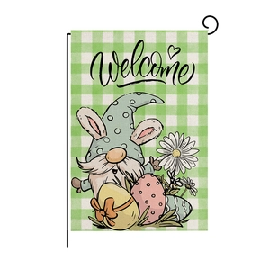 Easter garden flag with Welcome gnome and colorful eggs on green plaid linen background