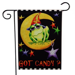 Detail of Halloween garden flag featuring a frog on a crescent moon with Got Candy text