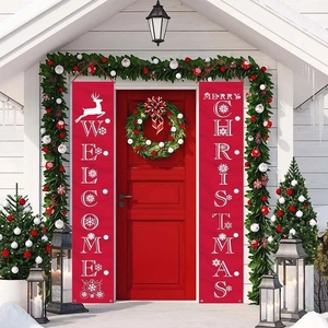 Outdoor setup of red Christmas door banners with Merry Christmas and Welcome deer prints