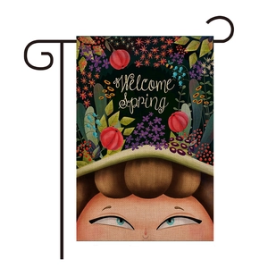 Garden flag detail showing high-quality linen texture with Welcome Spring illustration