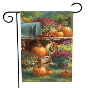 Vertical garden flag with autumn pumpkins and vintage blue mailbox on metal stand
