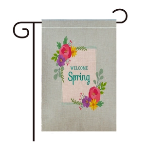 Close-up of linen garden flag with colorful spring flowers and black metal stand