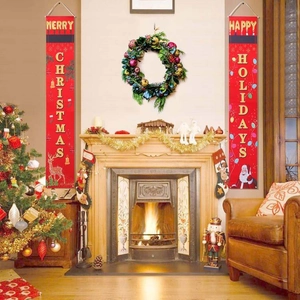 Detailed view of Merry Christmas and Happy Holidays door banners hanging by a cozy fireplace