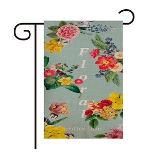 Detail of floral garden flag showing woven linen texture and vintage flower print