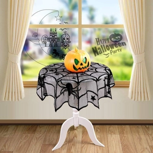 Black round lace Halloween tablecloth with spider web pattern on white round table