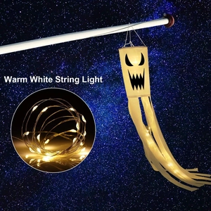 Detail of warm white LED string lights inside a Halloween ghost windsock decoration