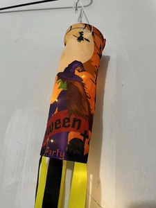 Close-up of LED glowing Halloween windsocks featuring a witch and castle design