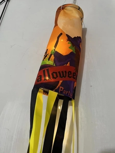 Glow-in-the-dark Halloween windsock featuring witch pattern and yellow silk streamers