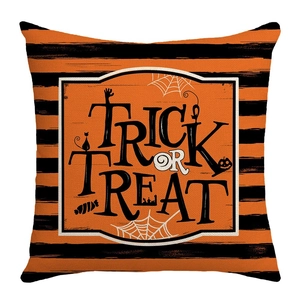 Close-up of Halloween cushion cover with Trick or Treat text and pumpkin motifs