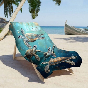 Microfiber beach towel with sea turtle print on a wooden chair by the ocean