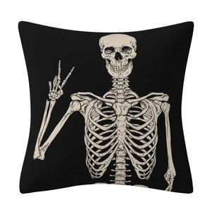 Close-up of textured linen pillowcase with cream skull and peace sign on black fabric