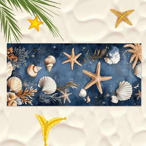 Blue ocean beach towel with seashell and coral prints on a sandy background