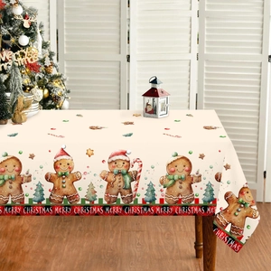 Christmas tablecloth with gingerbread man and candy cane patterns on a cozy festive setting