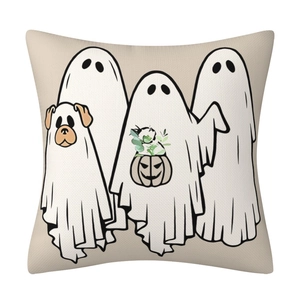 Detail of Halloween pillow case with ghosts and a dog ghost on beige woven fabric texture