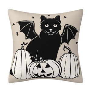 Close-up detail of Halloween cat and pumpkin pattern on beige linen cushion cover