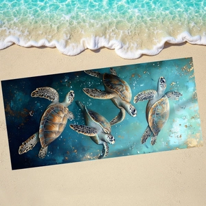 Detail of sea turtle beach towel showing microfibre texture on sand with ocean waves