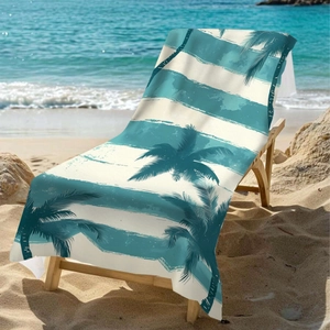 Microfiber beach towel with teal palm tree print on a wooden chair by the sea