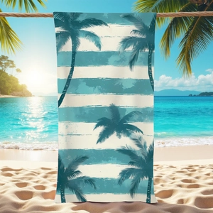 Microfiber beach towel with palm tree silhouette and blue stripes on a tropical beach