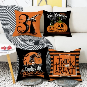 Set of 4 Halloween pillow covers featuring black cats, pumpkins, and witch hats on a sofa