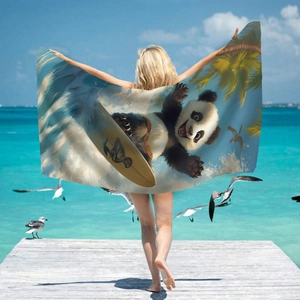 Microfiber beach towel featuring a surfing panda print and tropical scenery